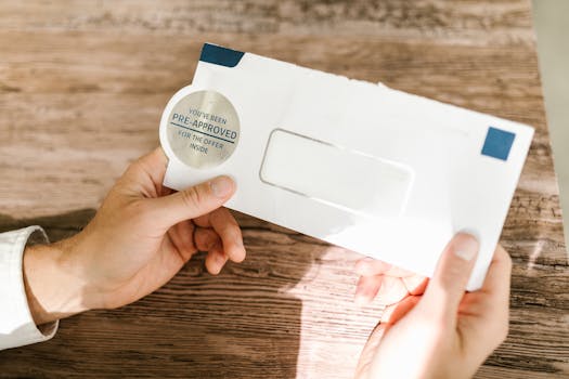 Advice A Person Holding White and Blue Envelope